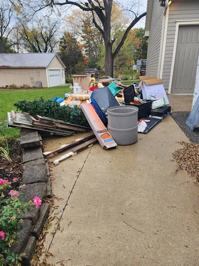 Dumpster being loaded with debris for 3 Yard Dumpster Rental in Dell Rapids